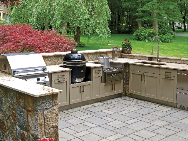 large outdoor kitchen on a tiled patio