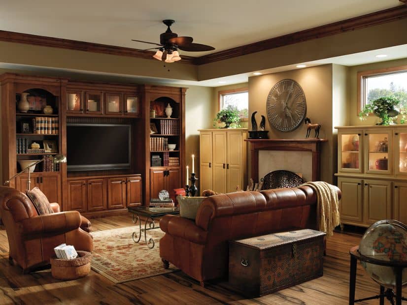 entertainment area with wooden and white cabinets